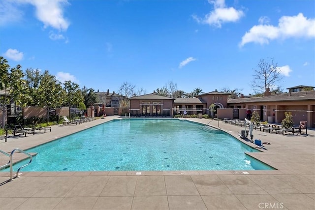 view of swimming pool featuring a patio area