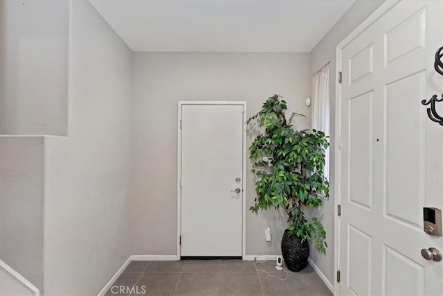 foyer entrance featuring light tile patterned flooring