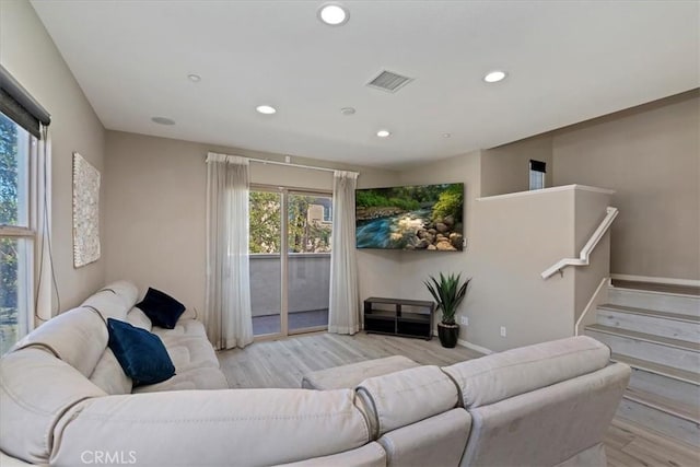 living room with light hardwood / wood-style floors