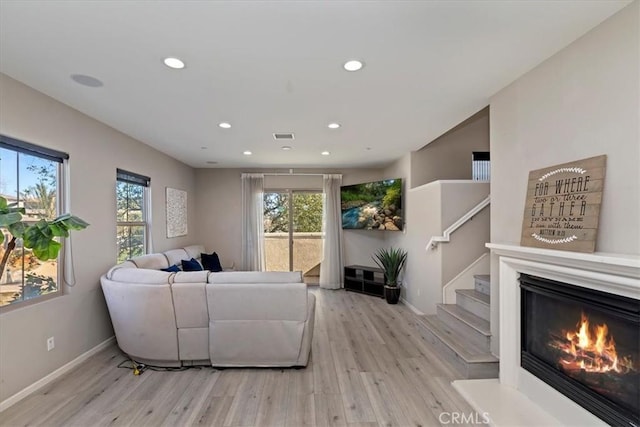 living room with light hardwood / wood-style flooring