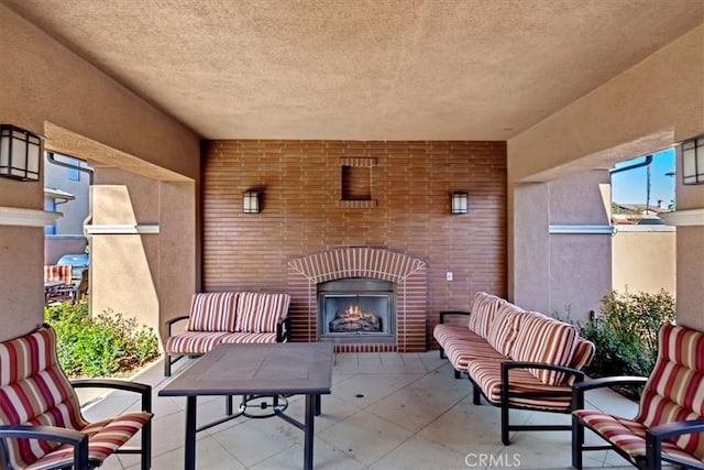 view of patio / terrace featuring an outdoor brick fireplace