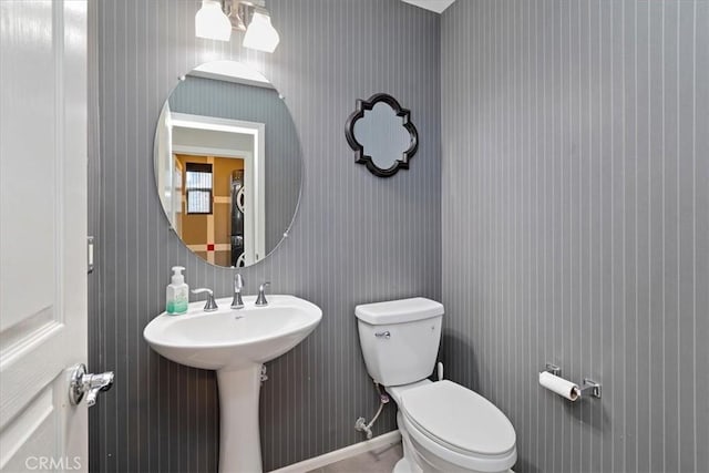 bathroom with toilet and sink