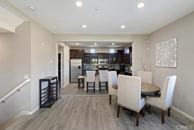 dining area featuring light wood-type flooring