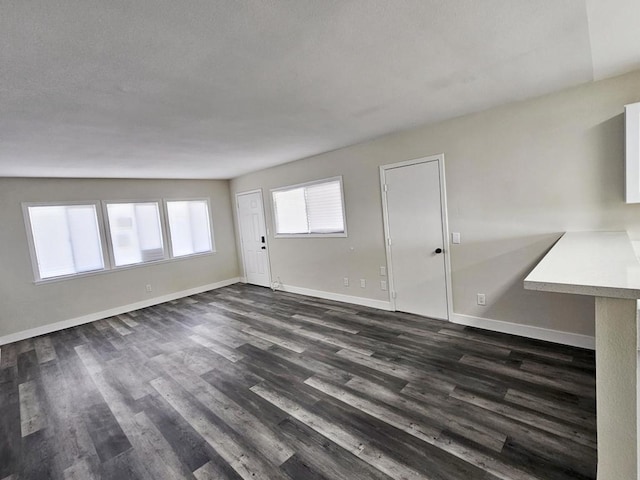 spare room featuring dark hardwood / wood-style floors