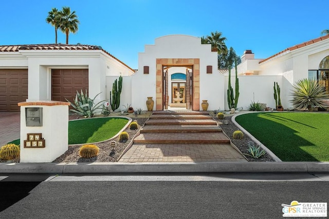 view of front of home with a garage