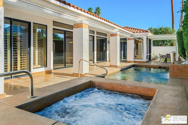 view of pool featuring a hot tub, a pergola, and a patio