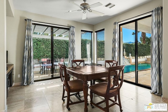 dining space featuring ceiling fan