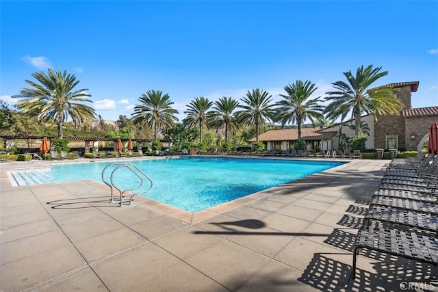 community pool featuring a patio