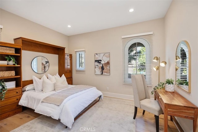 bedroom with light wood-type flooring