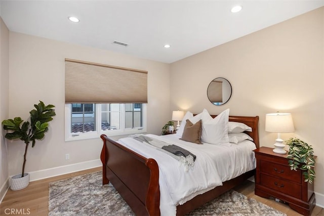 bedroom with light wood-type flooring