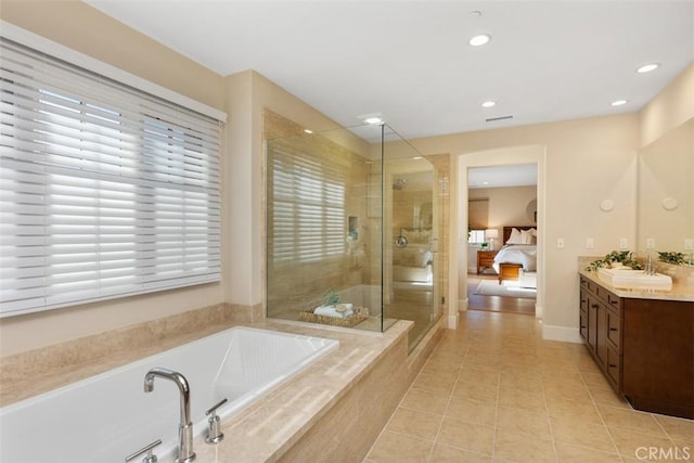 bathroom featuring vanity, tile patterned floors, and independent shower and bath