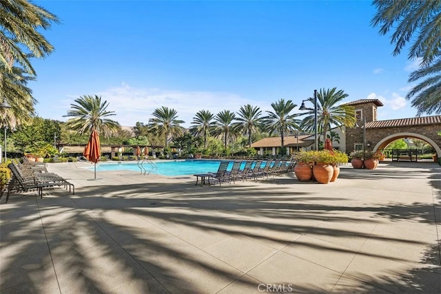 pool with a patio area