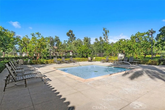 view of swimming pool featuring a patio area