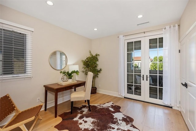 office featuring light wood-type flooring and french doors