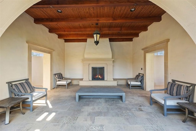 view of patio with a large fireplace