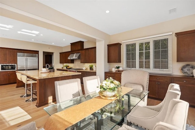 dining area featuring light hardwood / wood-style floors