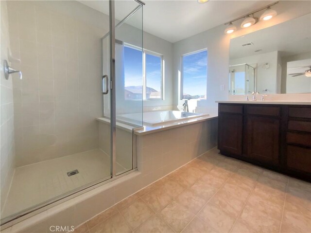 bathroom featuring shower with separate bathtub, vanity, tile patterned floors, and ceiling fan