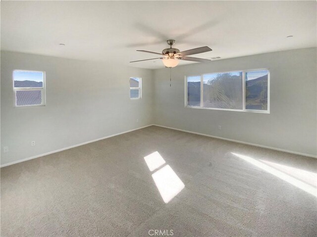 carpeted empty room with ceiling fan