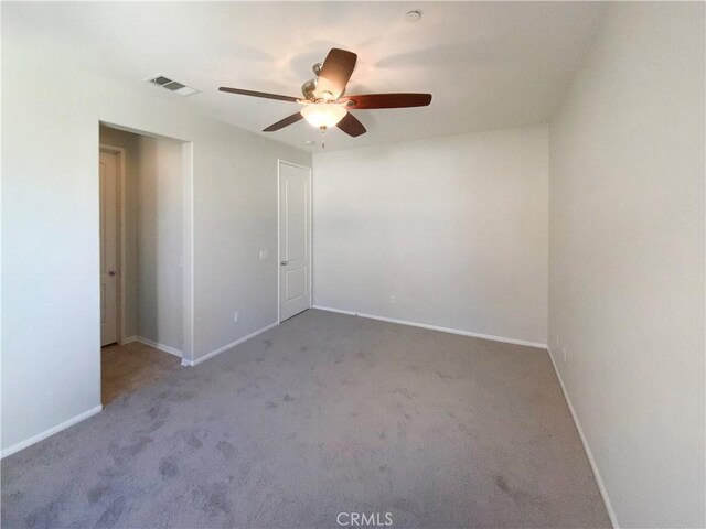 unfurnished room with light carpet and ceiling fan