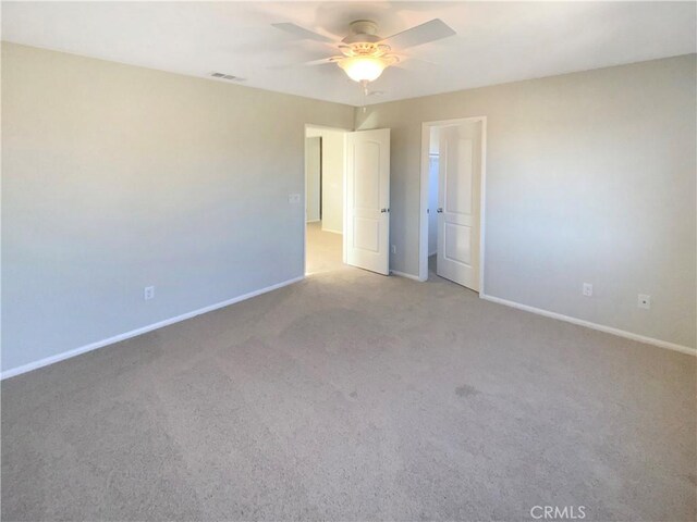 empty room with light carpet and ceiling fan