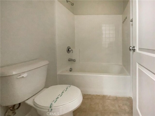 bathroom featuring bathing tub / shower combination and toilet