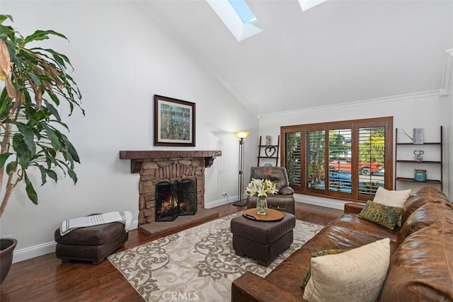 living room featuring high vaulted ceiling, a skylight, dark hardwood / wood-style floors, and a stone fireplace