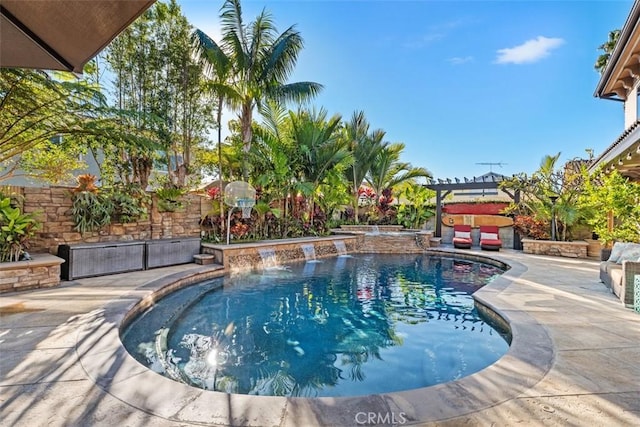 view of swimming pool featuring a pergola, a patio area, pool water feature, and a jacuzzi