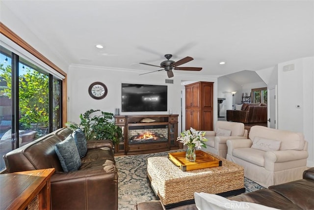 living room featuring ceiling fan and ornamental molding