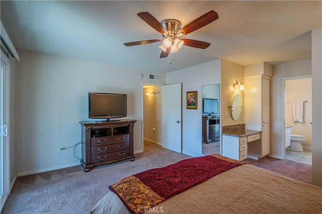 carpeted bedroom featuring ceiling fan and connected bathroom