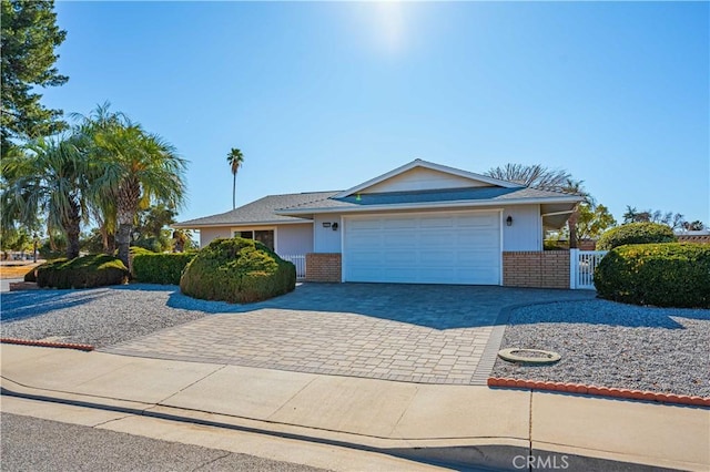 ranch-style house featuring a garage