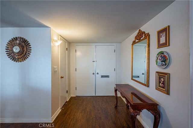 corridor featuring dark wood-type flooring