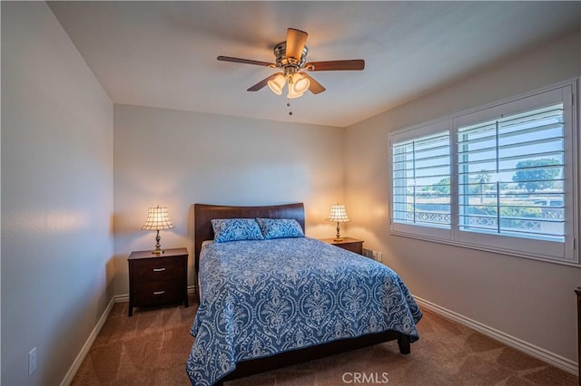 bedroom with ceiling fan and carpet