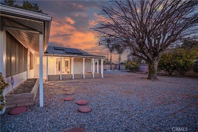 view of yard at dusk