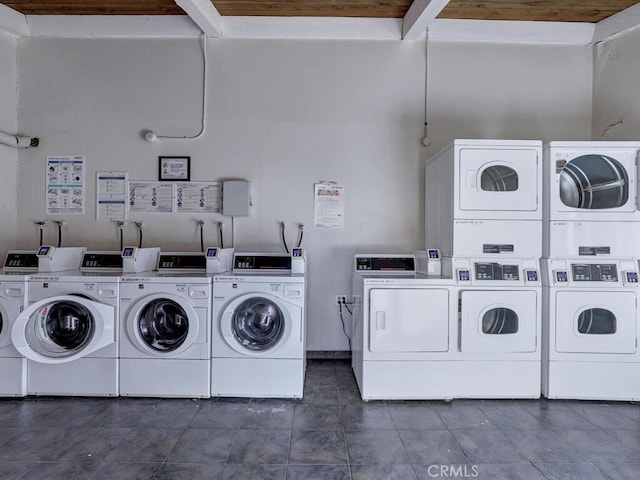 washroom with stacked washer and dryer and washer and dryer