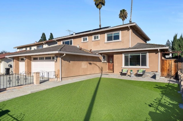 back of house featuring a lawn