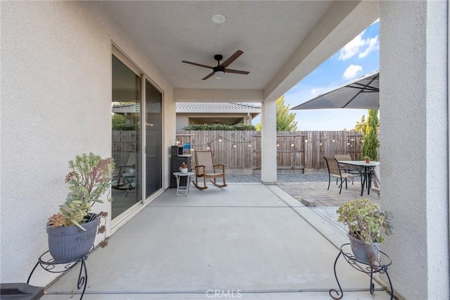 view of patio / terrace featuring ceiling fan