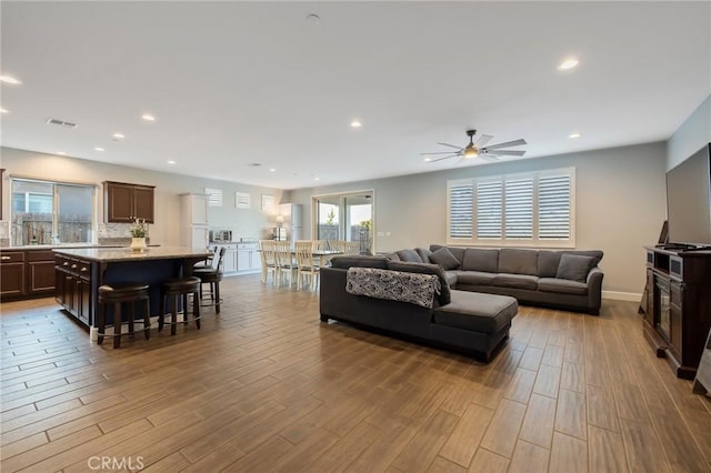 living room featuring ceiling fan