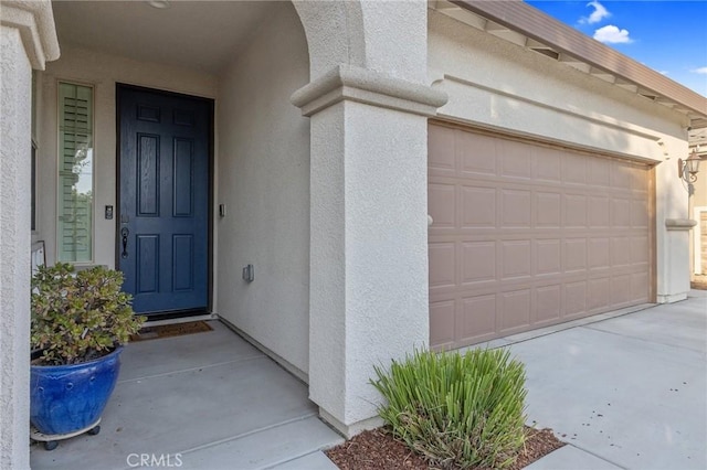 entrance to property featuring a garage