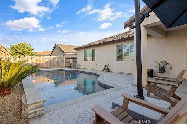 view of swimming pool featuring central AC and a patio area