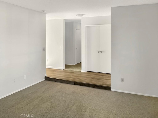 unfurnished room with carpet floors