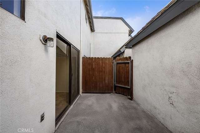 view of patio featuring fence