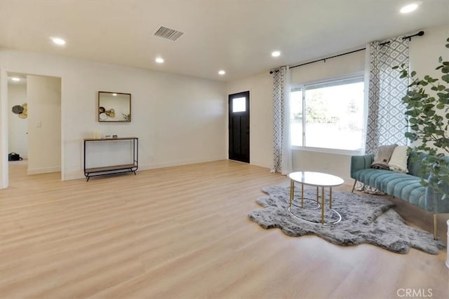 living room with light hardwood / wood-style floors