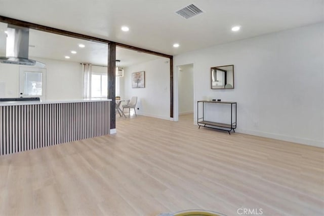 unfurnished living room featuring light wood-type flooring