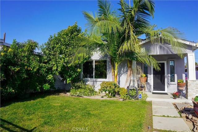 view of front of home with a front lawn