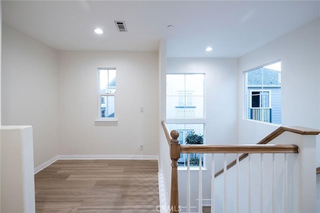 stairs with hardwood / wood-style flooring