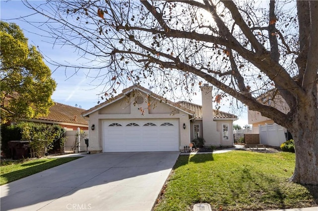 view of front facade featuring a garage and a front lawn