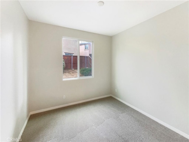 unfurnished room with carpet flooring