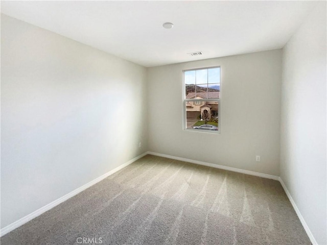 unfurnished room featuring carpet