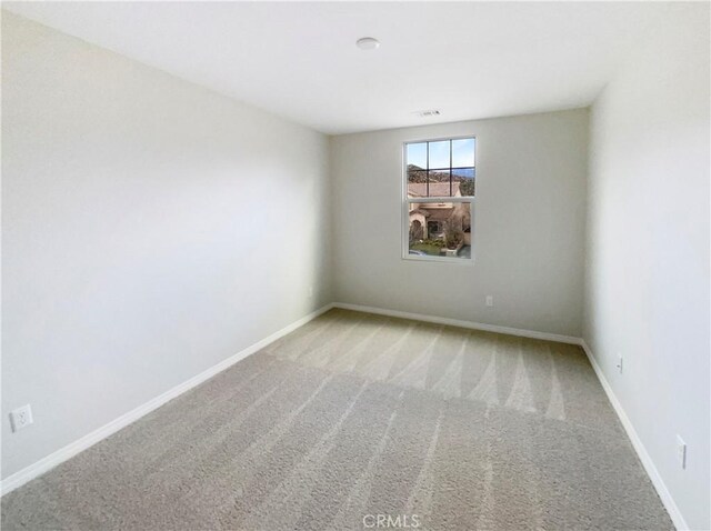 empty room featuring carpet flooring