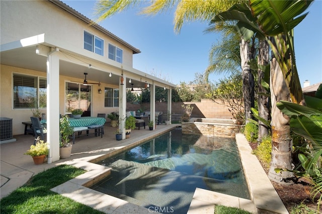 view of pool with a patio area and ceiling fan